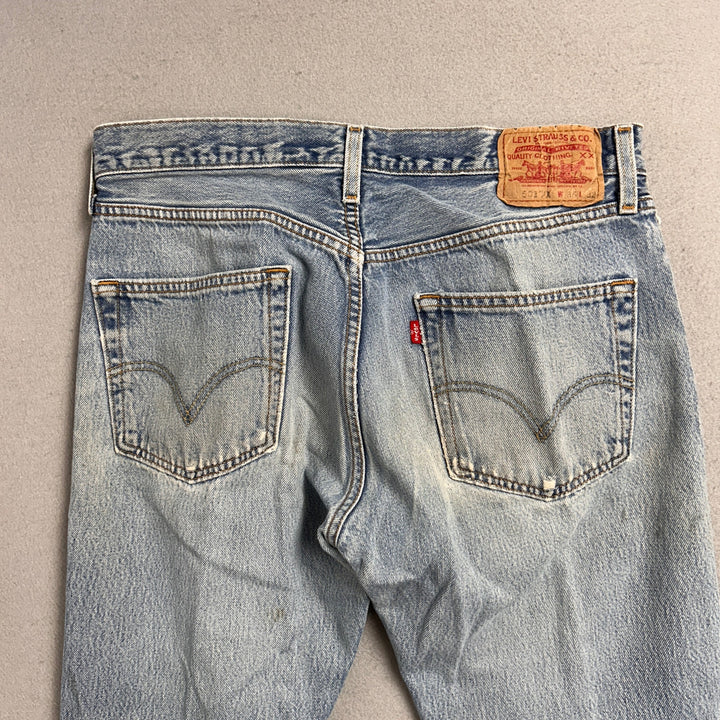 Vintage Levi's 501xx Light Wash Distressed Jeans Made in USA Men's 34x29