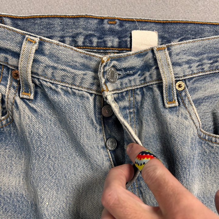 Vintage Levi's 501xx Light Wash Distressed Jeans Made in USA Men's 34x29