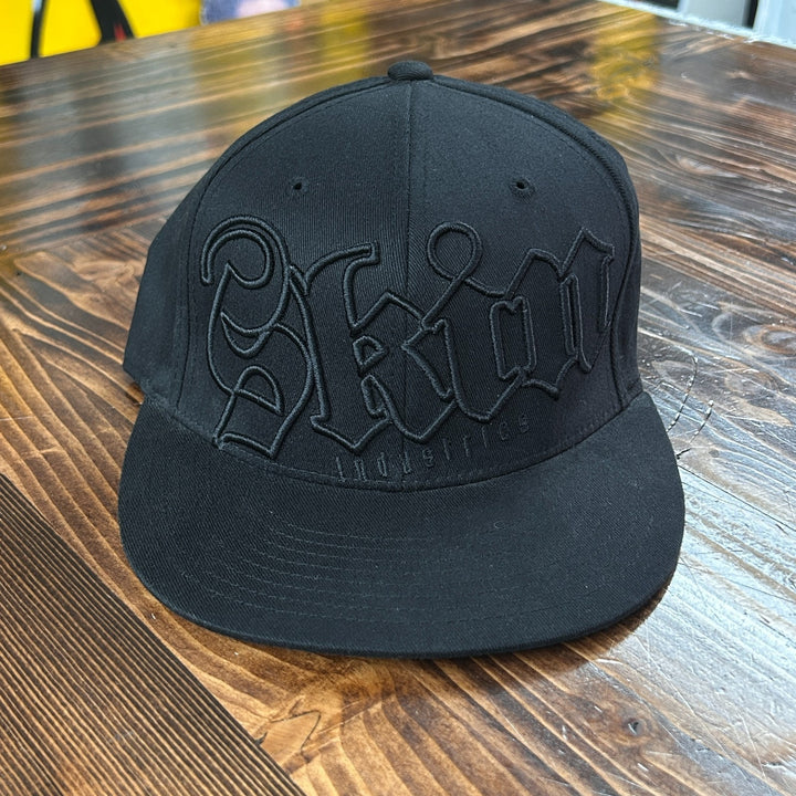 VTG Skin Industries Embroidered Flexfit S-M Black Graphic Trucker Hat Y2K