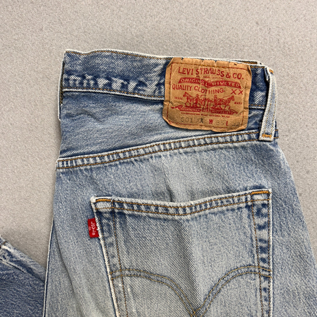 Vintage Levi's 501xx Light Wash Distressed Jeans Made in USA Men's 34x29